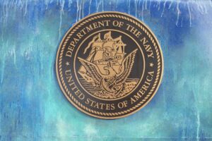 Navy challenge coin with eagle and ship emblem