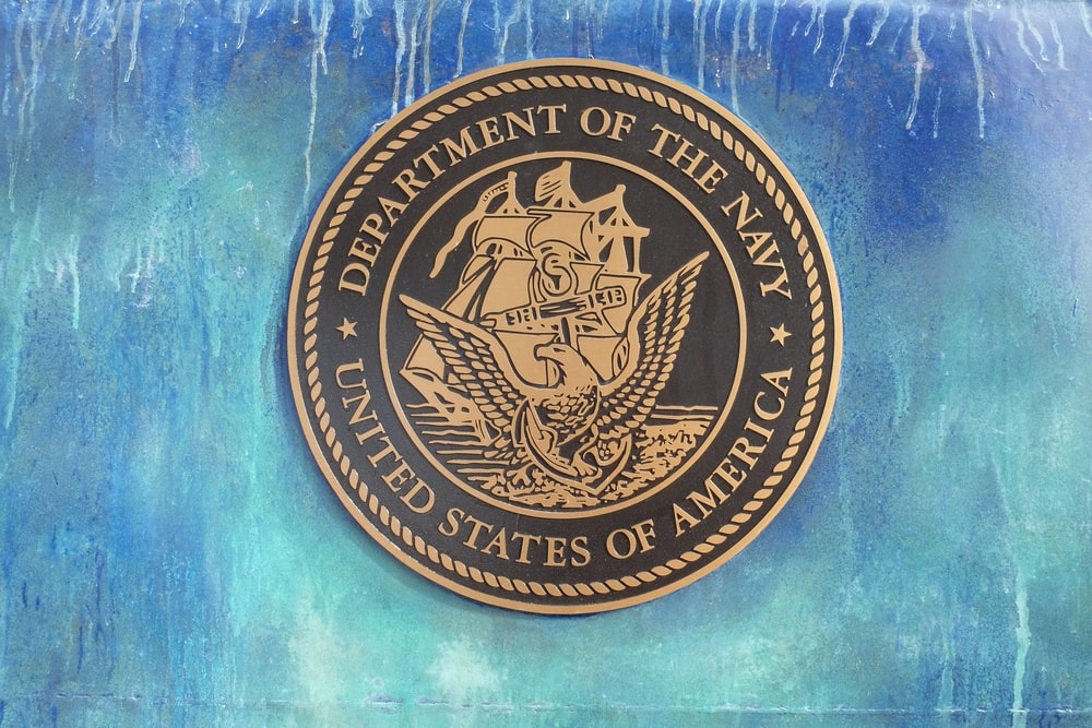 Navy challenge coin with eagle and ship emblem